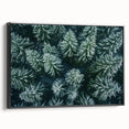 Framed canvas wall art showcasing a serene landscape with trees, designed in a modern style. The artwork features rich green hues and detailed textures, perfect for enhancing home decor.
