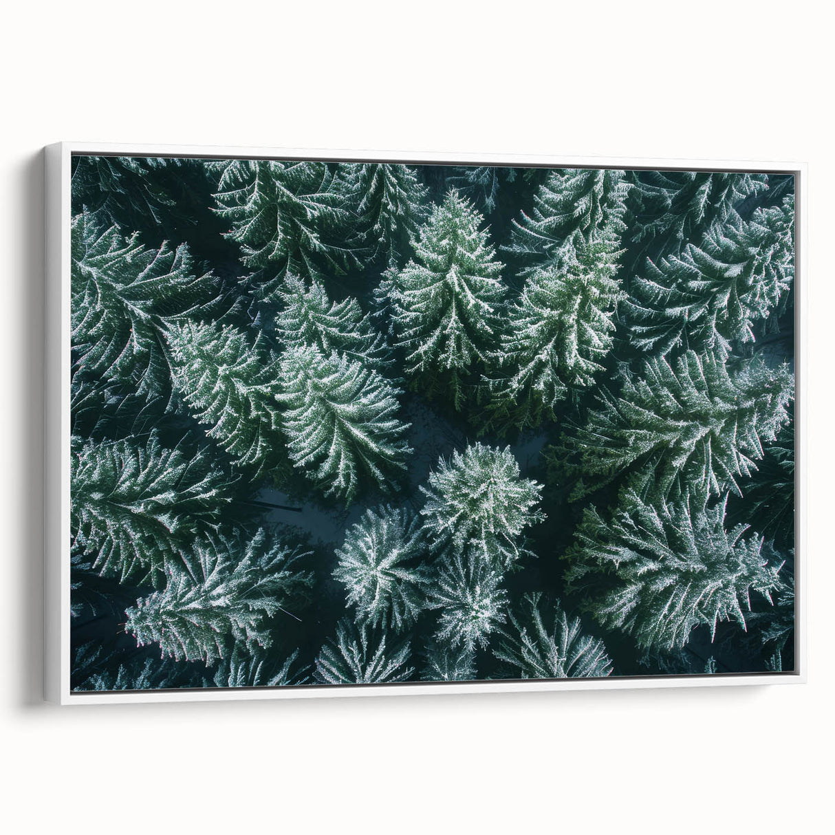 Framed canvas wall art showcasing a serene landscape with lush green trees, featuring a modern white frame and elegant side view display, ideal for home decor.