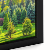 Close-up of a framed canvas wall art featuring a serene landscape with lush green trees and vibrant blue skies, perfect for home decor. The intricate details and colors enhance any room's ambiance, making it an ideal choice for nature lovers.