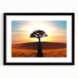 Framed wall art featuring a serene landscape with trees, presented in a sleek black frame with a mat, enhancing any modern home decor aesthetic.