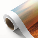 Rolled canvas artwork showcasing a vibrant landscape featuring lush green trees and a serene sky, perfect for home decor and nature enthusiasts. The design adds a touch of tranquility to any room.