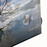 Close-up of a vibrant acrylic glass wall art piece showcasing a contemporary landscape design with lush green trees and soft, diffused lighting, ideal for modern home decor.