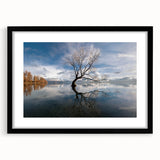Framed wall art showcasing a serene landscape with trees in a contemporary black frame, featuring a white mat for an elegant presentation, perfect for home decor.
