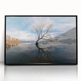 Framed wall art featuring a vibrant landscape design with stylized trees, set in a sleek black frame, perfect for modern home decor and interior aesthetics.