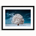 Framed wall art featuring a serene landscape design with trees, set in a sleek black frame with a mat, ideal for home decor and nature enthusiasts.