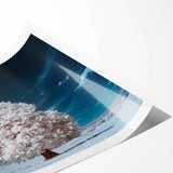 Vibrant rolled wall art print showcasing an abstract landscape with lush green trees and a serene blue sky, perfect for enhancing home decor.