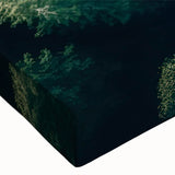 Close-up of a stretched canvas wall art collection showcasing vibrant landscapes with lush green trees, perfect for enhancing home decor and adding nature-inspired elegance.