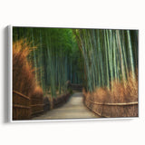 Framed canvas wall art depicting a serene landscape with vibrant green trees and a soft blue sky, showcasing natural beauty in a modern white frame.
