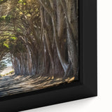 Close-up of a framed canvas wall art piece showcasing a vibrant landscape with lush green trees and a serene blue sky, perfect for home decor and nature lovers.