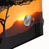 Close-up of an acrylic glass wall art piece showcasing a serene landscape with green trees and a blue sky, perfect for modern home décor.