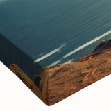 Close-up of a stretched canvas wall art piece showcasing a vibrant landscape with lush green trees, intricate details, and rich colors, perfect for home decor.