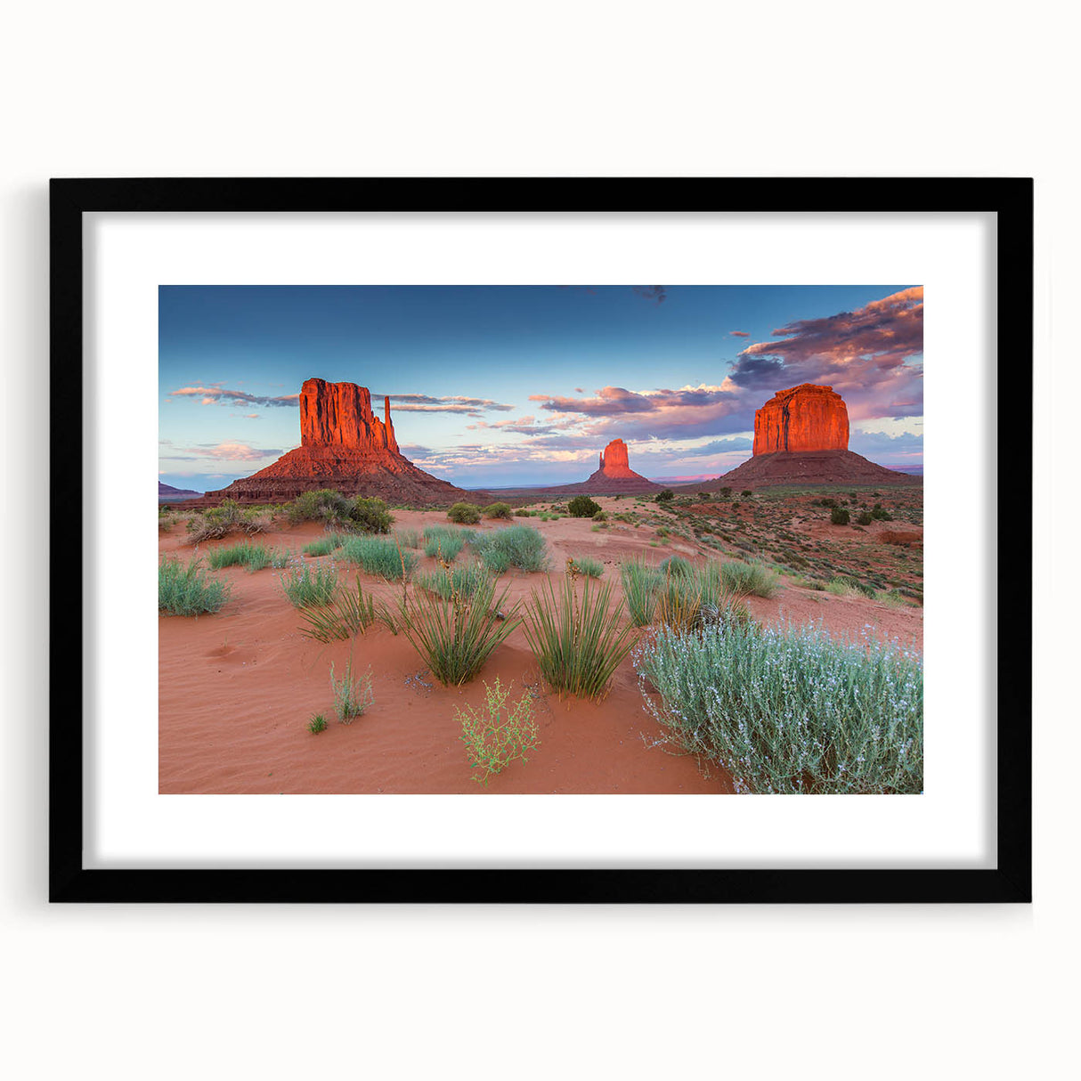 Framed wall art depicting a serene valley landscape with rich green hills and a vibrant blue sky, featuring a sleek black frame and mat, ideal for home decor.