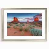 Framed wall art featuring a serene landscape design with a silver mat, showcasing a picturesque valley scene that adds elegance to any room decor.