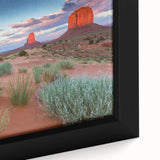 Framed canvas wall art featuring a serene valley landscape design with lush green hills and a sunset backdrop, showcasing vibrant colors and intricate details. Ideal for home decor, this artwork enhances any living space with its calming scenery.