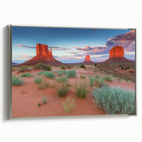 Framed canvas wall art depicting a serene valley landscape with vibrant colors and intricate details, featuring a sleek silver frame, ideal for home decor.