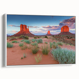 Framed canvas wall art showcasing a serene valley landscape design in soft hues of green and blue, with a sleek white frame, perfect for home decor.