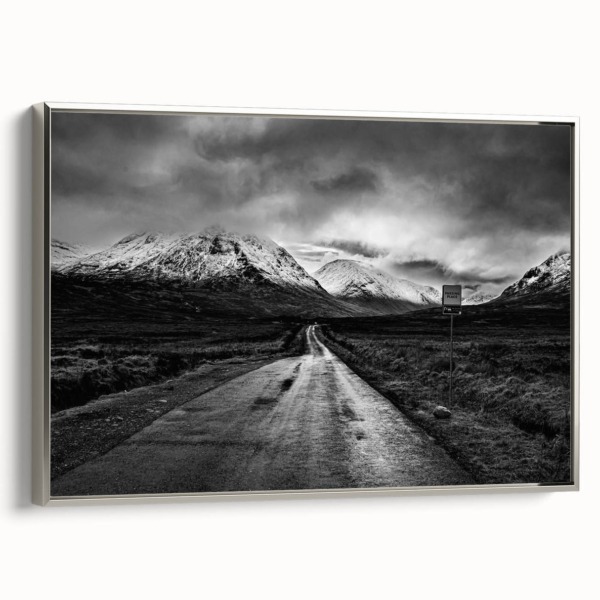 Framed canvas wall art showcasing a serene valley landscape design, featuring lush greenery and soft hues, elegantly displayed with a silver frame for a modern touch.