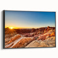 Framed canvas wall art depicting a serene valley landscape with rich green hues and dramatic mountain silhouettes. The artwork features a sleek black frame, enhancing its modern aesthetic. Perfect for adding a touch of nature to contemporary home decor.
