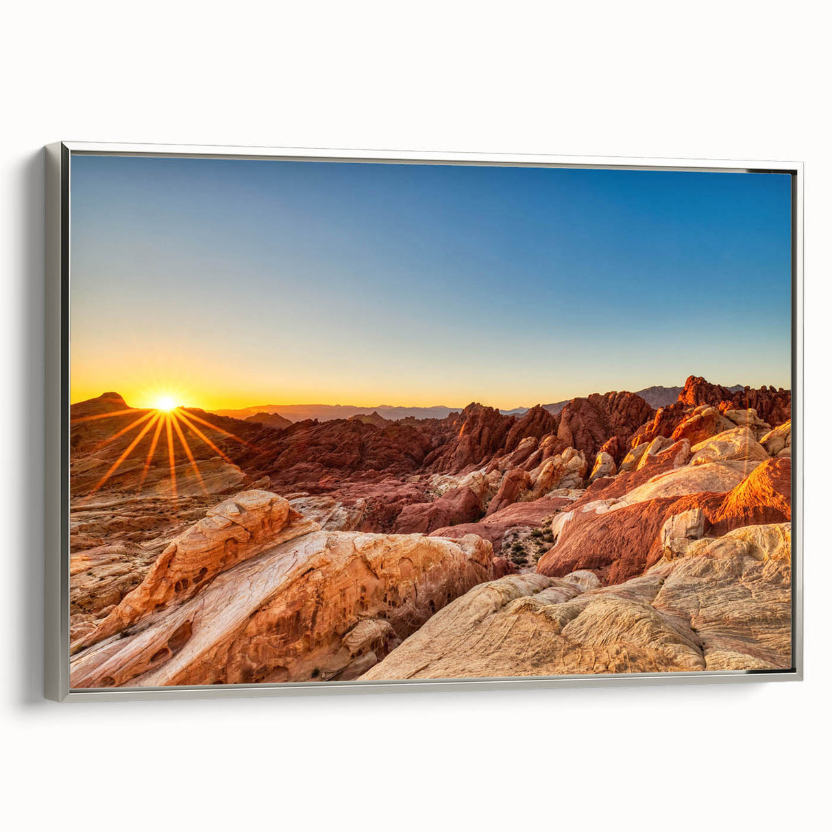Framed wall art showcasing a serene valley landscape with vibrant colors, silver frame highlighting the artwork, ideal for home decor or office settings.