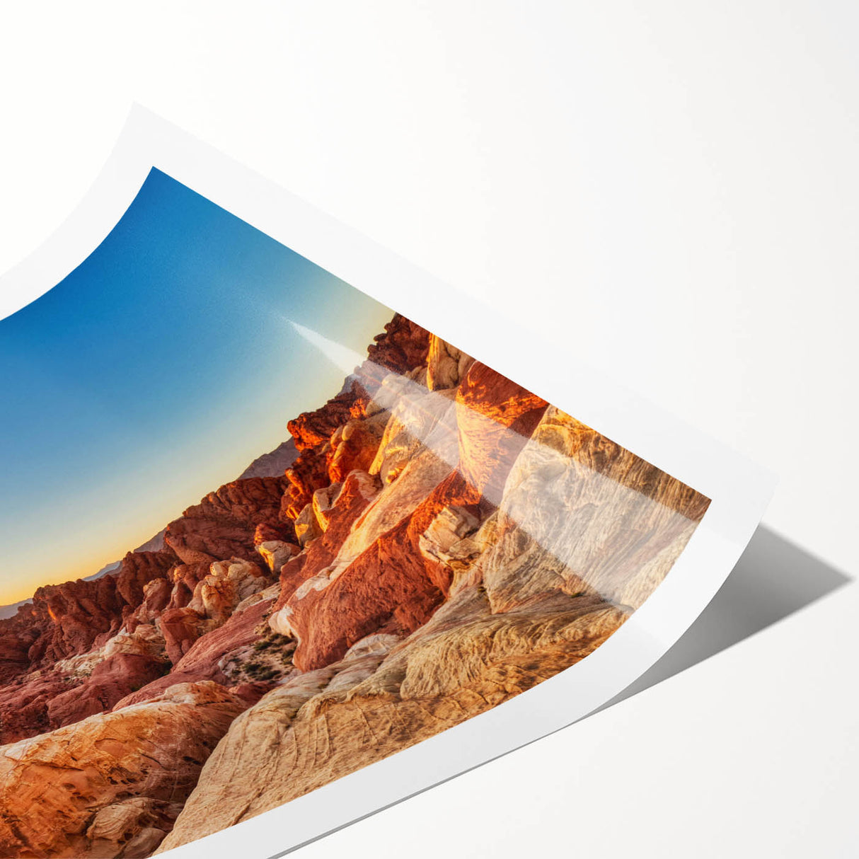 Vibrant landscape wall art print showcasing a serene valley scene with lush greenery and distant mountains, rolled for easy transport and display.