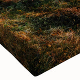 Vibrant close-up of a stretched canvas wall art piece showcasing a serene valley landscape design, featuring rich green hues and intricate detailing, perfect for home decor.