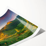 Serene landscape wall art print featuring a vibrant valley scene, showcasing lush greenery and rolling hills, rolled for easy shipping and display.