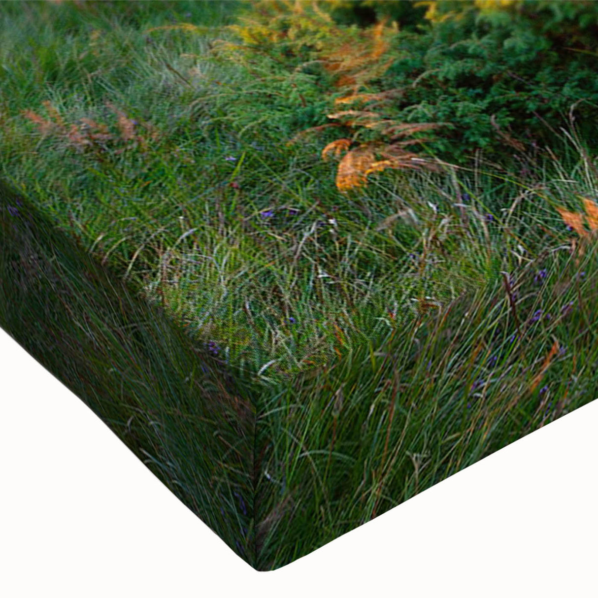 Close-up view of a stretched canvas featuring a vibrant landscape design with lush green valleys and blue skies, perfect for home decor and art enthusiasts.