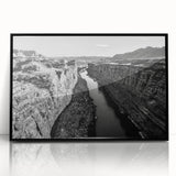 Framed acrylic wall art showcasing a serene valley landscape with rich green hues and dramatic mountain silhouettes, ideal for enhancing home decor aesthetics.