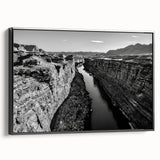 Framed canvas wall art collection showcasing a serene valley landscape design in vibrant colors, with a sleek black frame and side profile view, perfect for home decor.