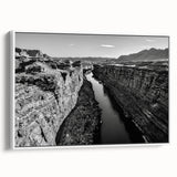 Framed canvas wall art showcasing a serene valley landscape design with rich colors and intricate details, displayed from a side view against a white background.