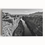 Stretched canvas wall art featuring a vibrant landscape design of a serene valley with rolling hills and a colorful sunset, ideal for home decor.