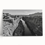 Stretched canvas wall art collection showcasing a serene valley landscape with vibrant greens and blues, elegantly leaning against a neutral background, perfect for home decor.