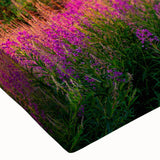 Close-up of a stretched canvas print showcasing a vibrant landscape design of a serene valley, highlighting rich colors and intricate details for home decor.