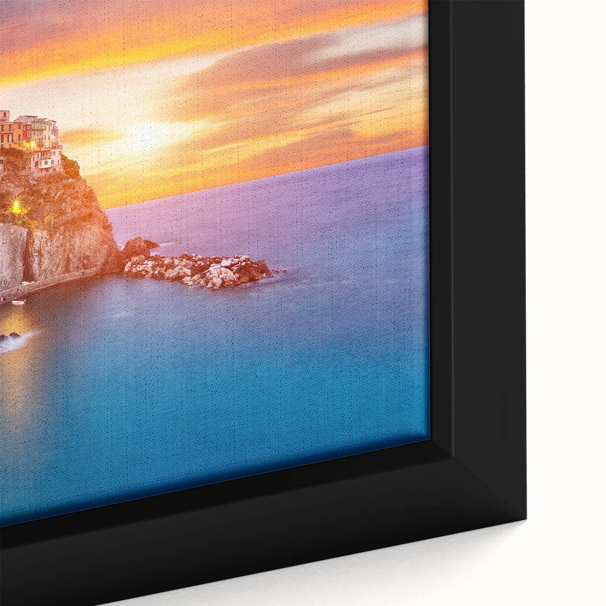 Framed canvas wall art showcasing a serene village landscape with lush greenery and soft pastel colors, adding a tranquil touch to home decor.