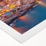 Vibrant rolled canvas showcasing a picturesque village landscape with colorful houses, lush greenery, and a serene sky, perfect for home decor.