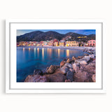 Framed wall art collection showcasing picturesque landscapes and quaint villages, featuring a white mat and sleek frame, ideal for home decor enhancement.