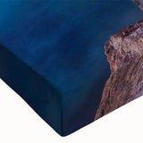 Close-up of a stretched canvas wall art depicting a vibrant landscape village scene, showcasing rich colors and intricate details, perfect for home decor.