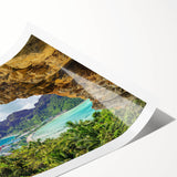 Rolled print showcasing a vibrant landscape village scene with lush greenery and colorful houses, designed for wall decor, presented in a protective cardboard tube.