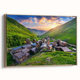 Framed canvas wall art showcasing a picturesque village landscape with rich colors and intricate details, highlighted by a stylish gold frame, ideal for home decor.