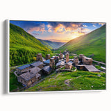 Framed canvas wall art depicting a picturesque village landscape, showcasing vibrant colors and intricate details, set against a white background for modern decor.