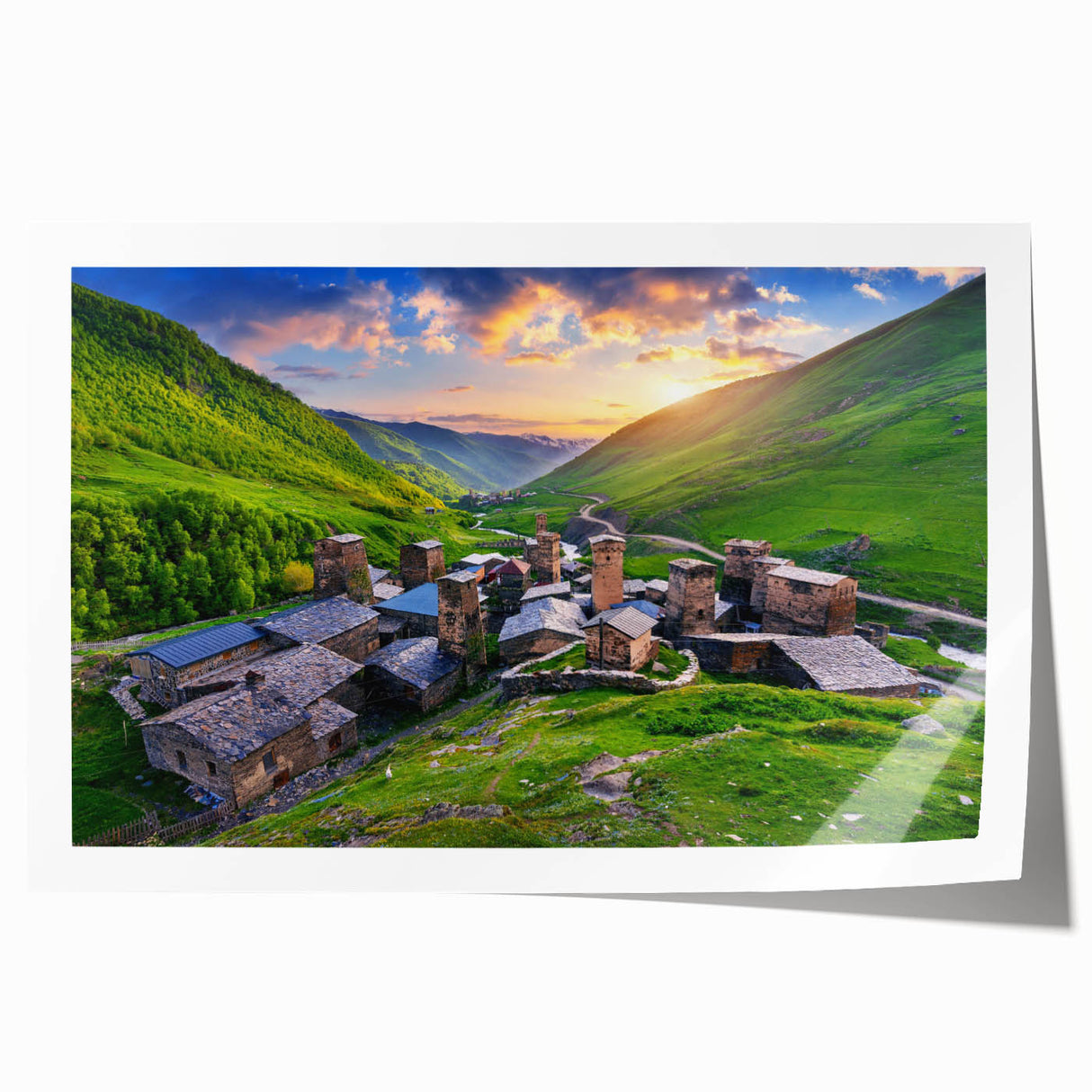 Rolled print of a serene landscape depicting a quaint village, featuring soft colors and intricate details, ideal for home decor, packaged in a protective tube.