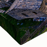 Close-up of a vibrant stretched canvas showcasing a colorful village landscape design, perfect for home decor, highlighting intricate details and textures.