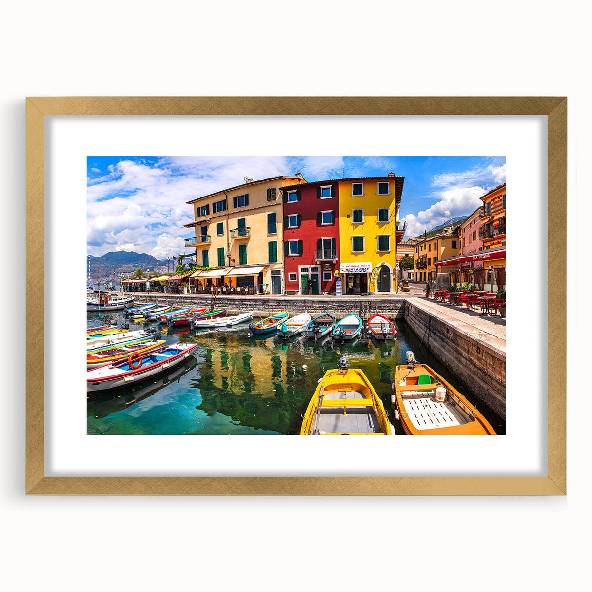 Framed wall art collection showcasing a picturesque village landscape design in gold, featuring a mat for added elegance, ideal for home decor enhancement.
