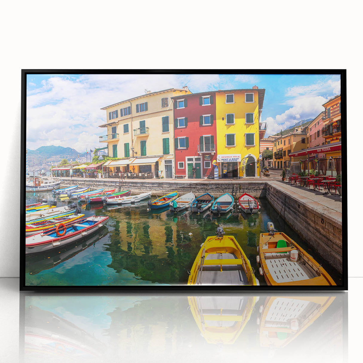 Framed acrylic wall art featuring a vibrant landscape design, showcasing a picturesque village scene with lush greenery and a clear blue sky, ideal for home decor.