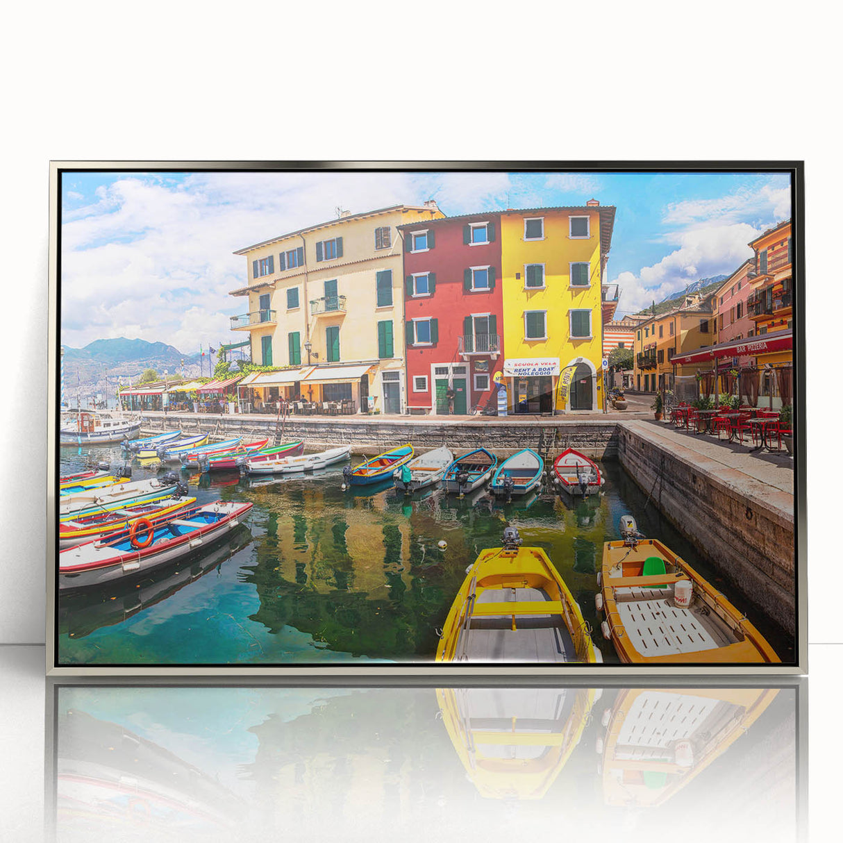 Framed acrylic wall art showcasing a vibrant landscape village design, featuring intricate details and a silver frame, perfect for enhancing home decor.
