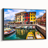 Framed canvas wall art showcasing a picturesque village landscape with vibrant colors, perfect for home decor. Features a sleek black frame and side view display.