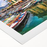 Rolled canvas artwork showcasing a vibrant landscape village design, featuring lush greenery and colorful buildings, ideal for home decor. Packaged securely in a cardboard tube for safe delivery.