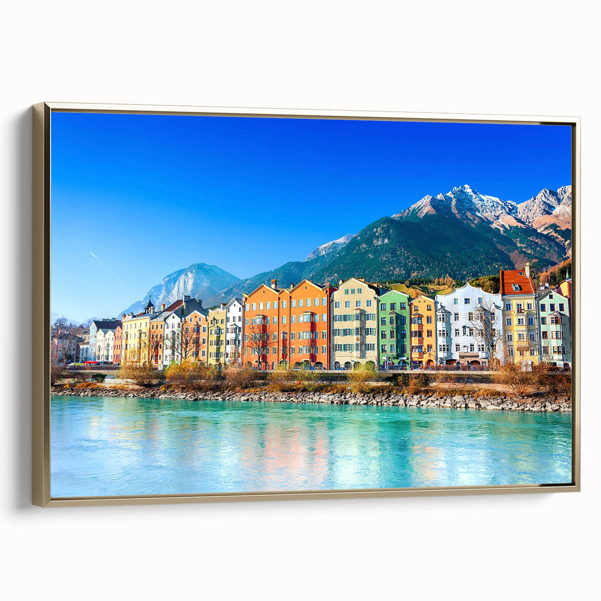 Framed canvas wall art featuring a scenic landscape of a quaint village, highlighting vibrant colors and intricate details, presented with a gold frame for an elegant touch. Perfect for home decor enthusiasts seeking a nature-inspired aesthetic.