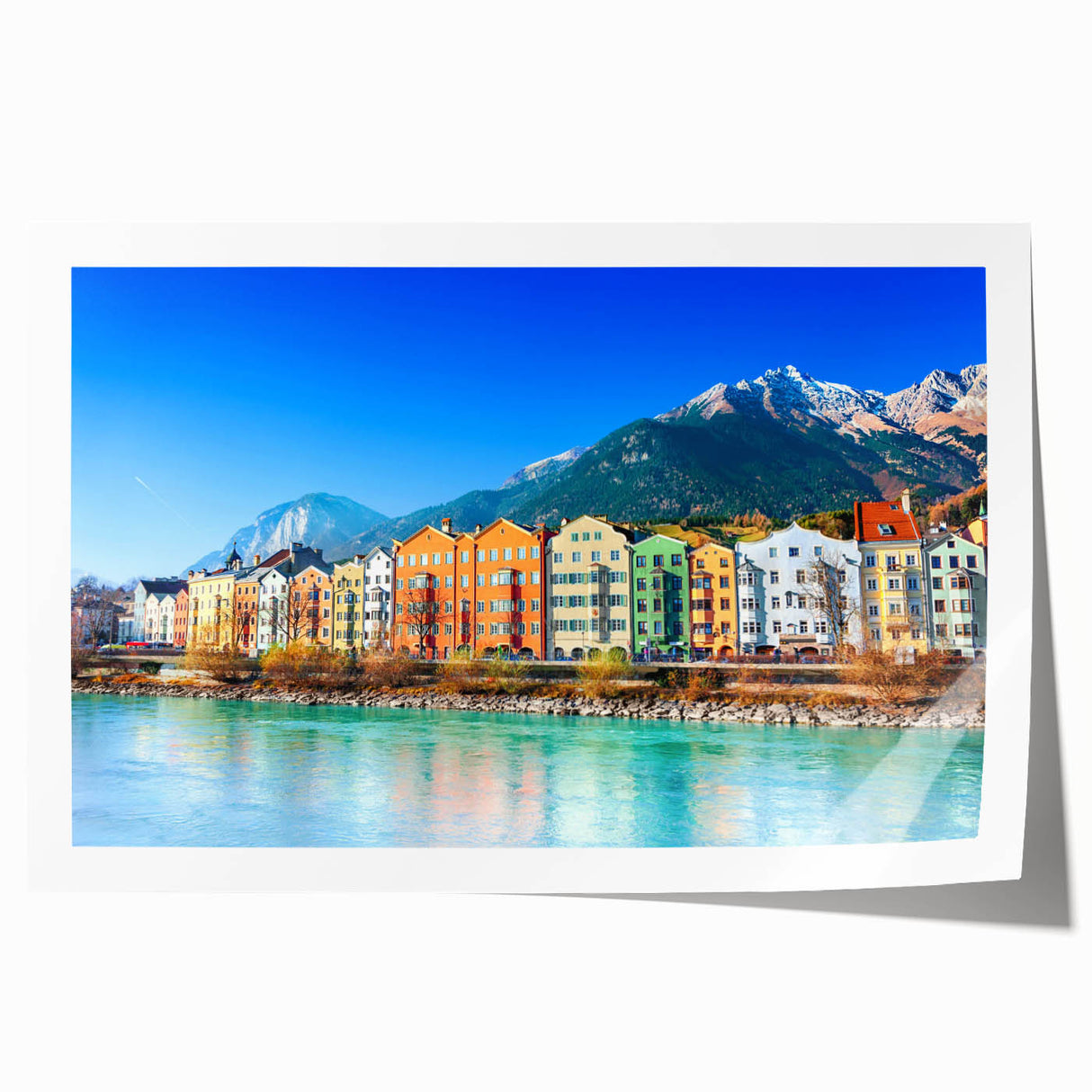 Rolled print of a vibrant landscape featuring a quaint village scene with lush greenery and colorful houses, ideal for home decor and art enthusiasts.