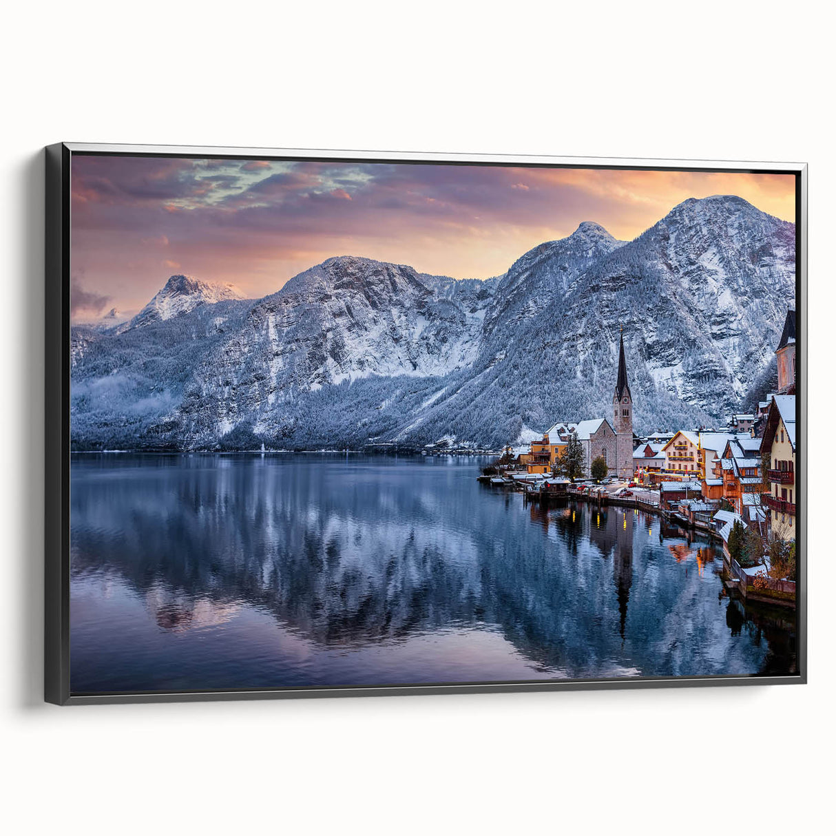 Framed canvas wall art showcasing a serene village landscape design with vibrant colors and intricate details, featuring a sleek black frame for an elegant presentation.